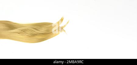 Strand of blond hair on white. Curls of hair. Blond wavy hair on white background Stock Photo