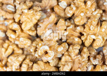 Heap raw peeled nuts in a macro, background and texture shot. Stock Photo