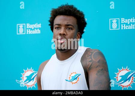 Miami Dolphins safety Jevon Holland (8) enters the field through the smoke  before an NFL football game against the Buffalo Bills, Sunday, Sept. 25,  2022 in Miami Gardens, Fla. The Dolphins defeat