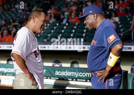 HOUSTON, TX - JUNE 19: (left to right) Houston Astros manager Dusty Baker Jr.  (12) speaks to University of Houston head basketball coach Kelvin Sampson  during the MLB game between the New