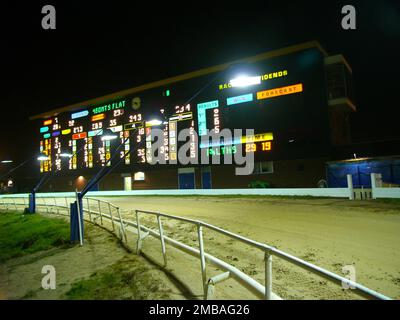 Hall Green Greyhound Stadium, York Road, Hall Green, Birmingham, 2005. The illuminated scoreboard at Hall Green Greyhound Stadium, illuminated during a race night. Hall Green Greyhound Stadium was opened in 1927 despite opposition from local residents. The stadium later also included a speedway track (closed 1937) and football pitch (1951-1965). Investment and development during the late 20th century saw Hall Green win the Greyhound Racing Association Racecourse of the Year award in 2002. The stadium closed in 2017 and was demolished in 2018; the site was subsequently redeveloped as housing. Stock Photo