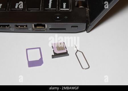 laptop sim slot insert Internet sim card Stock Photo
