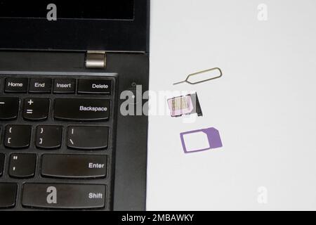 laptop sim slot insert Internet sim card Stock Photo