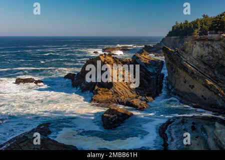 Sandstone formations and Pacific Ocean at Shore Acres State Park on the Oregon Coast, USA Stock Photo
