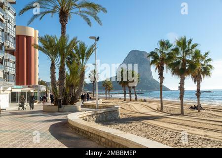 Beach and seafront promenade at Calpe, Spain. Penon de Ifach in background Stock Photo