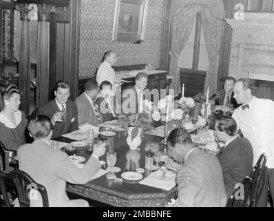 Portrait of Nesuhi Ertegun, Adele Girard, Joe Marsala, Zutty Singleton, Max Kaminsky, Ahmet M. Ertegun, Sadi Coylin, and Benny Morton(?), Turkish Embassy, Washington, D.C., 1938. Stock Photo