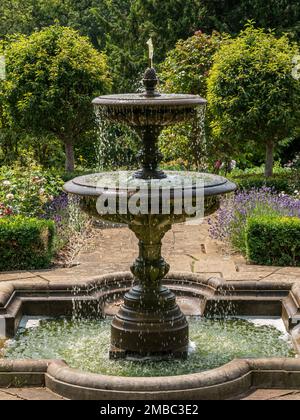 Tiered ornamental garden water fountain in the Rose Garden at Belvoir Castle, Leicestershire, England, UK Stock Photo