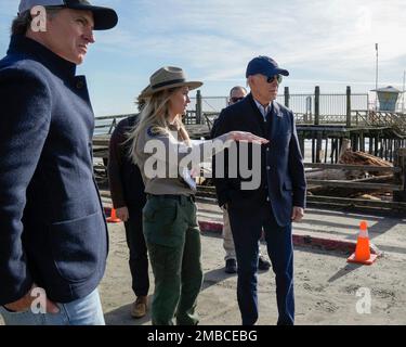 Aptos, United States Of America. 19th Jan, 2023. Aptos, United States of America. 19 January, 2023. U.S President Joe Biden, right, listens to a park ranger during a tour of areas damaged by freak rain storms with California Gov. Gavin Newsom, left, at Seacliff State Park, January 19, 2023 in Aptos, California. Credit: Adam Schultz/White House Photo/Alamy Live News Stock Photo