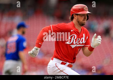 Cincinnati Reds' Kyle Farmer hits an RBI single during the fourth inning of  the team's baseball game against the Arizona Diamondbacks in Cincinnati,  Tuesday, April 20, 2021. (AP Photo/Aaron Doster Stock Photo 