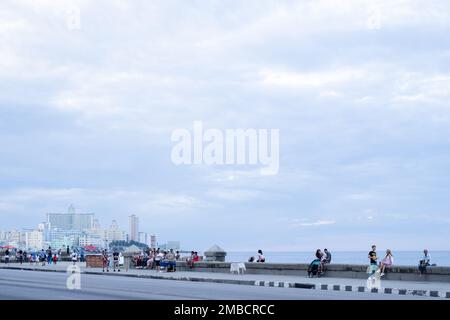 People enjoying the Malecón in the evening, Havana, Cuba Stock Photo