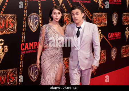 Caylee Cowan, left, and Casey Affleck arrive at the amfAR Gala Los