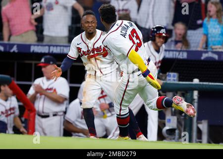 Ozzie Albies messes with Ronald Acuña Jr.