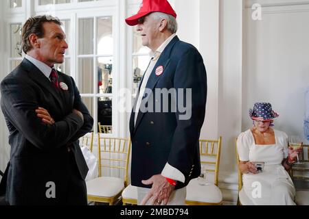 Former NFL football player, Doug Flutie, left, speaks with Keith Boyles  during an election night watch party for U.S. Senate candidate Herschel  Walker, Tuesday, May 24, 2022, in Atlanta. (AP Photo/Brynn Anderson