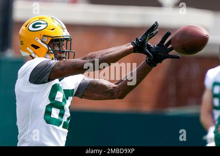 Green Bay Packers' Romeo Doubs gets into the endzone for a