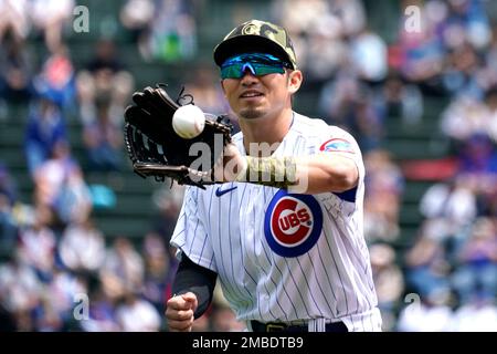 Chicago Cubs' Seiya Suzuki, of Japan, adjusts his hat as he pauses in the  dugout prior to a baseball game against the Arizona Diamondbacks Sunday,  May 15, 2022, in Phoenix. (AP Photo/Ross