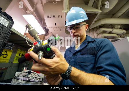 220615-N-IW069-1044 SAN DIEGO (June 15, 2022) Airman Angel Mainville, a native of Phoenix, Ariz., gathers tools to calibrate pressure equipment aboard Nimitz-class aircraft carrier USS Carl Vinson (CVN 70), June 15. Vinson is currently pierside in its homeport of San Diego. Stock Photo