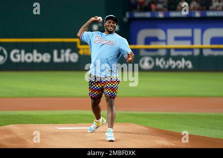 Dallas Cowboys player Micah Parsons walks to the mound to throw out the  ceremonial first pitch before a baseball game between the Los Angeles  Angels and the Texas Rangers, Tuesday, May 17