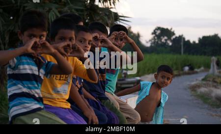 Village children in Bangladesh. Children are playing on the banks of the river. Stock Photo