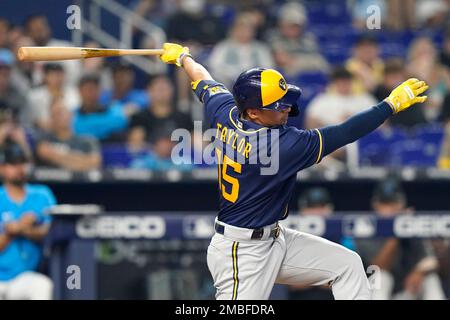 Milwaukee Brewers' Tyrone Taylor (15) removes his helmet after striking out  during the third inning of a baseball game against the Miami Marlins,  Friday, May 7, 2021, in Miami. (AP Photo/Lynne Sladky