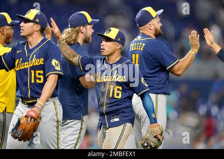 Milwaukee Brewers' Tyrone Taylor (15) removes his helmet after striking out  during the third inning of a baseball game against the Miami Marlins,  Friday, May 7, 2021, in Miami. (AP Photo/Lynne Sladky