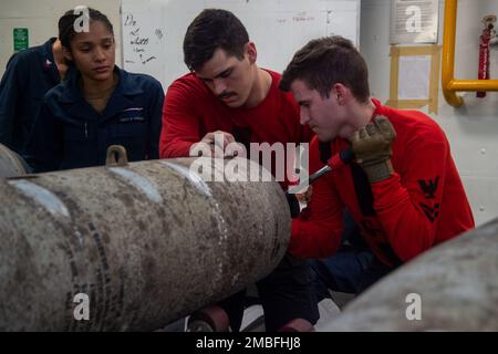 220615-N-YX844-1075 PHILIPPINE SEA (June 15, 2022) Sailors assemble ordnance in a weapons magazine aboard the U.S. Navy’s only forward-deployed aircraft carrier USS Ronald Reagan (CVN 76), during Valiant Shield 2022 (VS22). VS22 is a U.S.-only, biennial field training exercise (FTX) focused on integration of joint training in a multi-domain environment. This training builds real-world proficiency in sustaining world forces through detecting, locating, tracking and engaging units at sea, in the air, on land and in cyberspace in response to a range of mission areas. Stock Photo