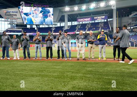 Former Florida Marlins players applaud as Livan Hernandez is