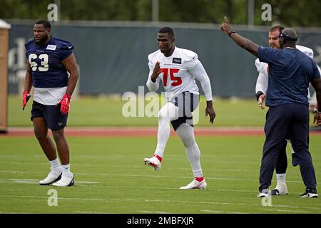 Houston Texans defensive end Adedayo Odeleye (75) walks toward the huddle  during the second half of an NFL preseason football game against the New  Orleans Saints Saturday, Aug. 13, 2022, in Houston. (