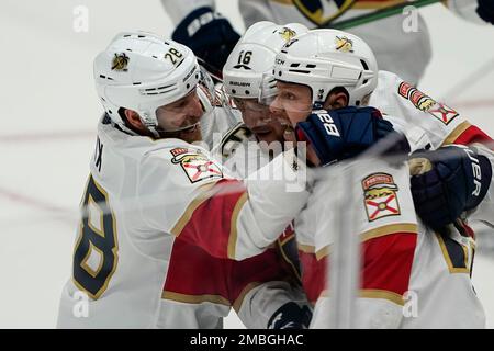 Linesman Vaughan Rody (73) hugs Florida Panthers right wing Claude Giroux  (28) after Panthers defeated the