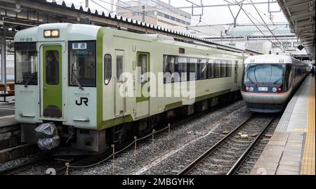 Japan Rail (JR East) KiHa 100 Series trains in the rain at Odate