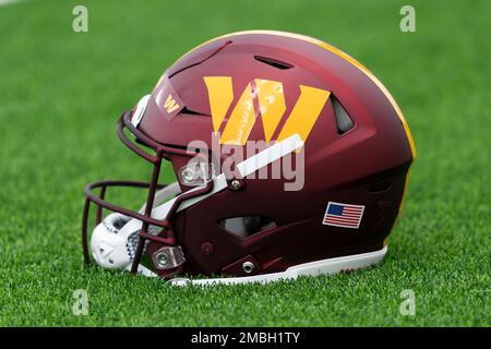 HOUSTON, TX - NOVEMBER 20: A Commander helmet sits idle on the sideline  during the football game between the Washington Commanders and Houston  Texans at NRG Stadium on November 20, 2022 in