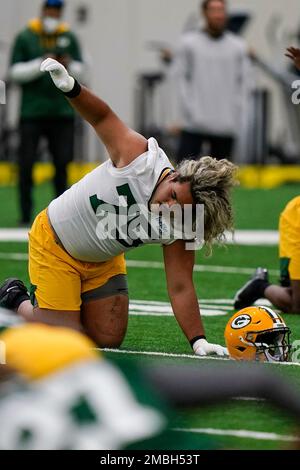 Green Bay Packers' Sean Rhyan and George Moore run a drill at the NFL  football team's practice field training camp Tuesday, May 31, 2022, in Green  Bay, Wis. (AP Photo/Morry Gash Stock