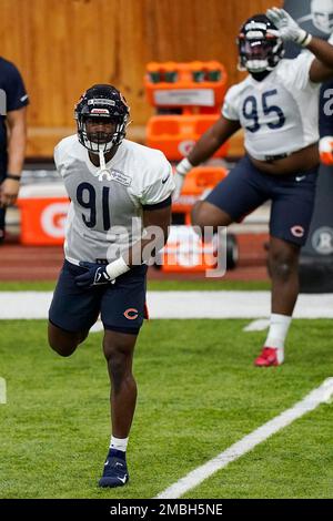 Chicago Bears defensive end Dominique Robinson (91) warms up with teammates  during the NFL football team's rookie minicamp at Halas Hall in Lake  Forest, Ill., Friday, May 6, 2022. (AP Photo/Nam Y.