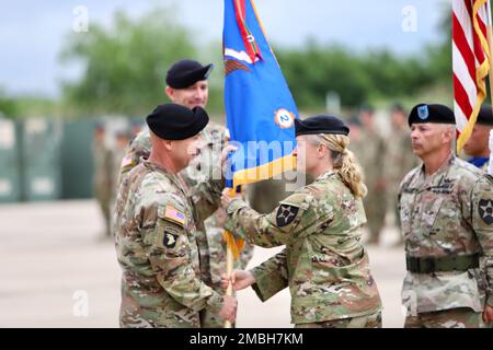 Today, 2-2 Assault Helicopter Battalion, 2nd Combat Aviation Brigade, conducted a change of command. Col. Aaron Martin receives the battalion colors from Lt. Col. Bridget Dalziel, the outgoing commander. Stock Photo