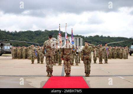 Today, 2-2 Assault Helicopter Battalion, 2nd Combat Aviation Brigade, conducted a change of command. Col. Aaron Martin is accompanied by Lt. Col Bridget Dalziel, the outgoing commander and Lt. Col. Scott Gale, the incoming commander, saluting the formation prior to inspecting them. Stock Photo