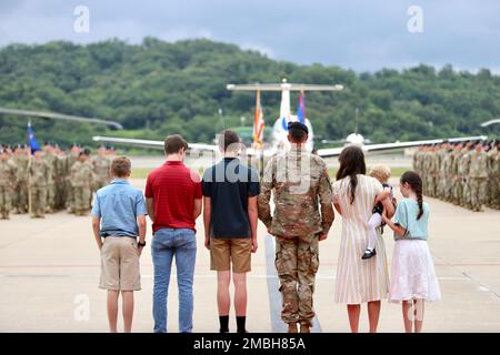 Today, 2-2 Assault Helicopter Battalion, 2nd Combat Aviation Brigade, conducted a change of command. Lt. Col. Scott Gale, the incoming commander, stands with his family in front of the formation before each company marches by in the pass and review. Stock Photo