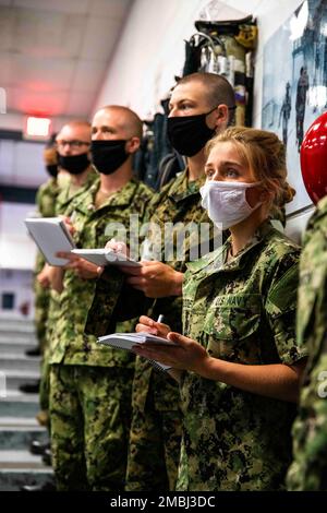 220616-N-PW480-0022 GREAT LAKES, Ill. (June 16, 2022) – Naval Reserve Officers Training Corps (NROTC) New Student Indoctrination (NSI) midshipman candidates take notes while attending firefighting and damage control training at Recruit Training Command (RTC), June 16. Upon completion of NSI, the candidates will start their freshman year of the NROTC program at colleges and universities nationwide this fall. NSI is an indoctrination program hosted at RTC, and provides midshipmen with a common military training orientation. NSI provides basic training in five warfighting fundamentals – firefight Stock Photo