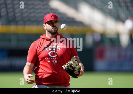 Colorado Rockies' Mike Moustakas warms up before a baseball game