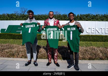 From left to right, Ahmad Gardner, Jermaine Johnson and Garrett Wilson pose  for a portrait while holding New York Jets jerseys Friday, April 29, 2022,  in Florham Park, N.J. (AP Photo/Brittainy Newman