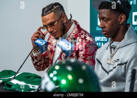 From left to right, Ahmad Gardner, Jermaine Johnson and Garrett Wilson pose  for a portrait while holding New York Jets jerseys Friday, April 29, 2022,  in Florham Park, N.J. (AP Photo/Brittainy Newman