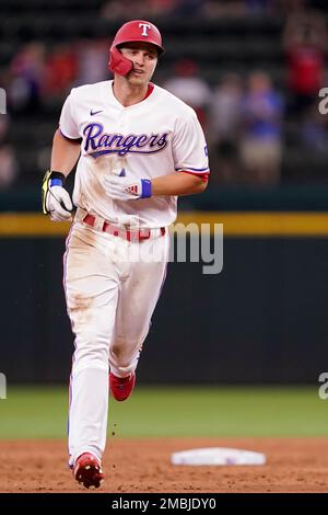 Texas Rangers' Corey Seager rounds the bases after hitting a home run ...