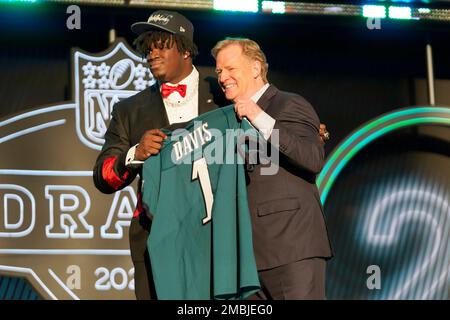 Georgia defensive tackle Jordan Davis holds a jersey after being