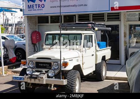 1984 Toyota Landcruiser white table top truck vehicle parked at a boat marina in Bayview,Sydney,NSW,Australia Stock Photo