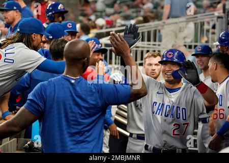 The Chicago Cubs' Seiya Suzuki (R) is congratulated by first base coach  Mike Napoli after hitting an RBI single in the fourth inning of a baseball  game against the Pittsburgh Pirates on