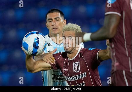 Aquilino Gimenez of Paraguay's Guairena FC, left, and Luciano Pons