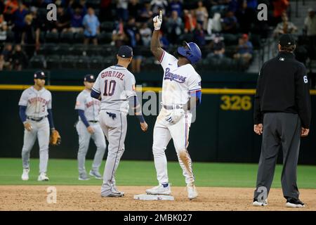 Adolis Garcia of the Texas Rangers celebrates with teammate Josh Jung after  hitting a solo home run against the New York Yankees during the fifth  inning at Globe Life Field on Apr.