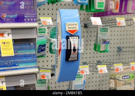 A wireless customer service call button at a Duane Reade drugstore. The button alerts workers to a customer requesting help in obtaining items from lo Stock Photo