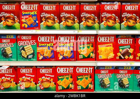 Boxes of different varieties of Cheez It on a grocery store shelf. Stock Photo