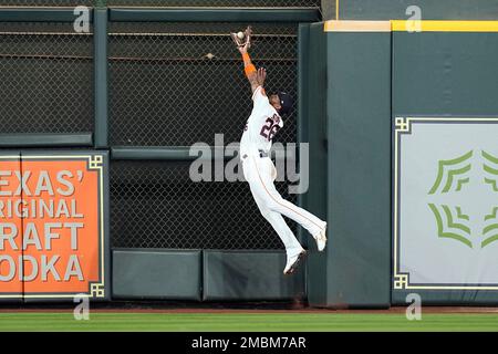 Houston Astros center fielder Jose Siri attempts to catch a fly