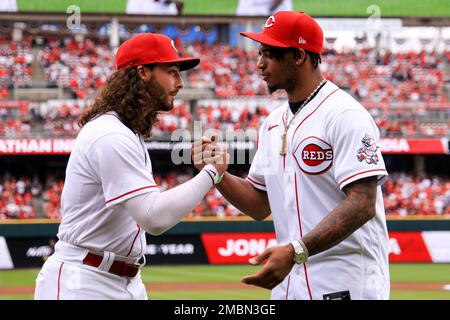 Cincinnati Reds' Jonathan India, left, receives the Major League