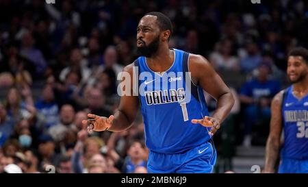 Dallas Mavericks guard Theo Pinson, right, reacts after scoring and drawing  a foul alongside forward Nic Claxton (33) in the second half of an NBA  basketball game against the Dallas Mavericks, Wednesday